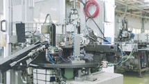 Automated assembly line for metal parts in the automotive industry