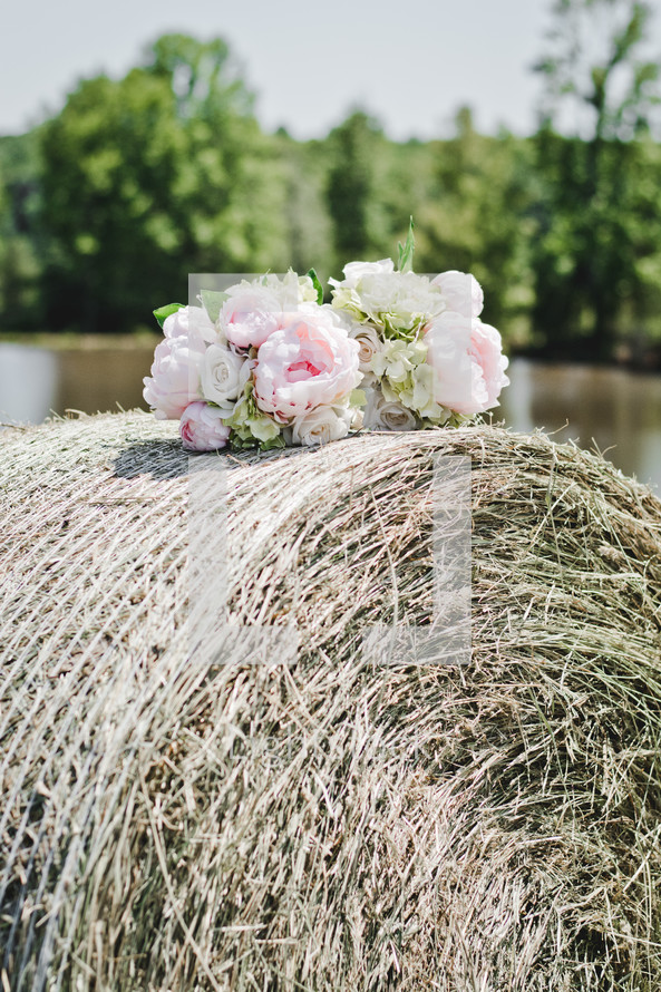 flowers on a hay bale 
