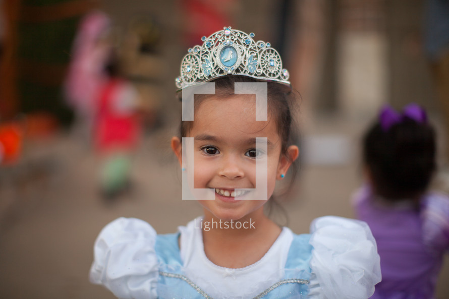 a little girl in a princess costume 