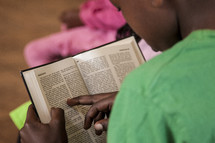 child reading the Bible