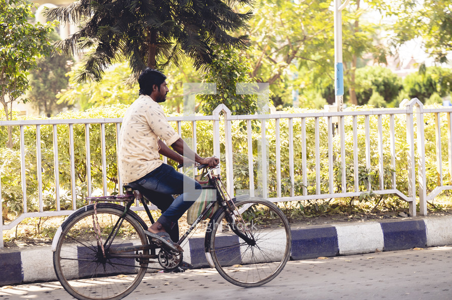 Man riding a bike in India