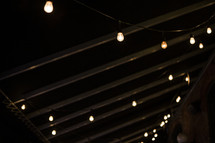 hanging lights from a ceiling outdoors 