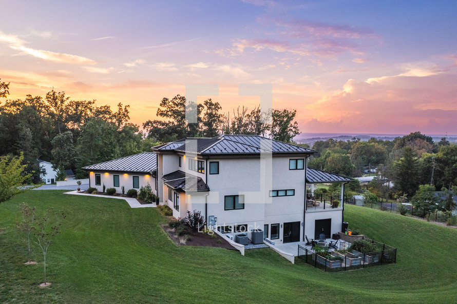 Luxury Home on a hill at sunset