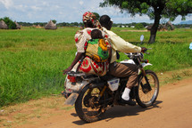 family on a motor bike in Africa