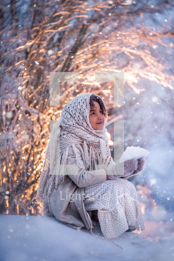 a girl holding snow 