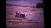 Menashe Heights, Israel, Circa 1940's. Color footage of combine harvester working in the wheat fields