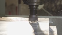 Machining process - high precision CNC mill manufacturing an advanced metal part