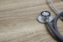 stethoscope on a wood background 