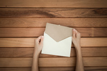 a man opening an envelope 