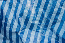 crinkled blue and white stripped background 