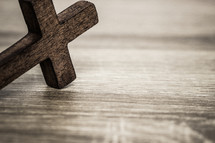wood cross on a wood background 