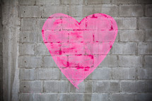 Heart painted on a brick wall.