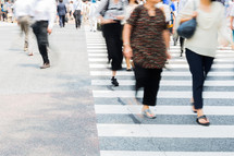 people crossing a crosswalk 