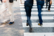 people crossing a crosswalk 