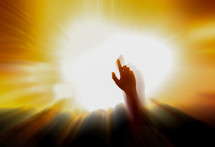 raised hand and radiating light 