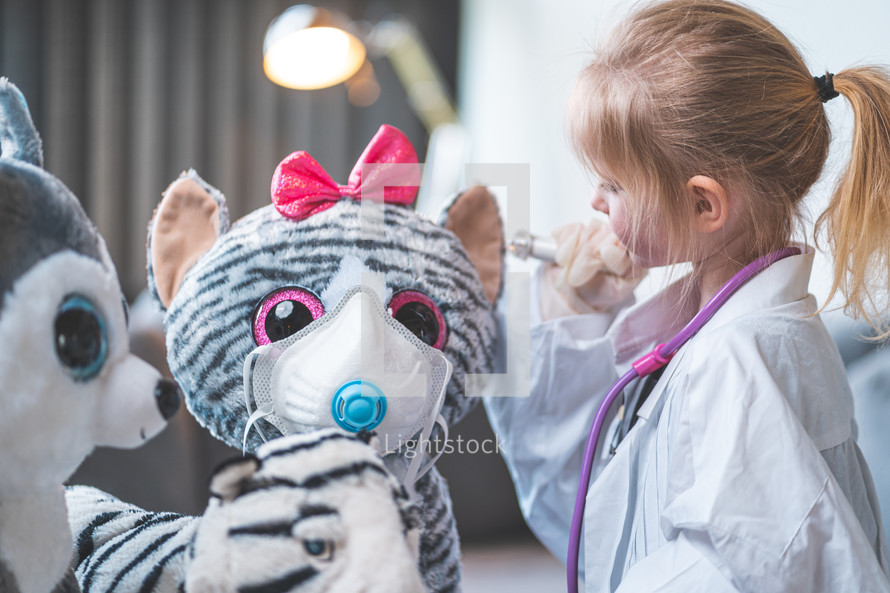 little girl playing doctor 