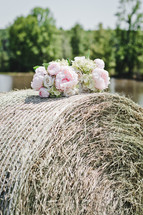 flowers on a hay bale 