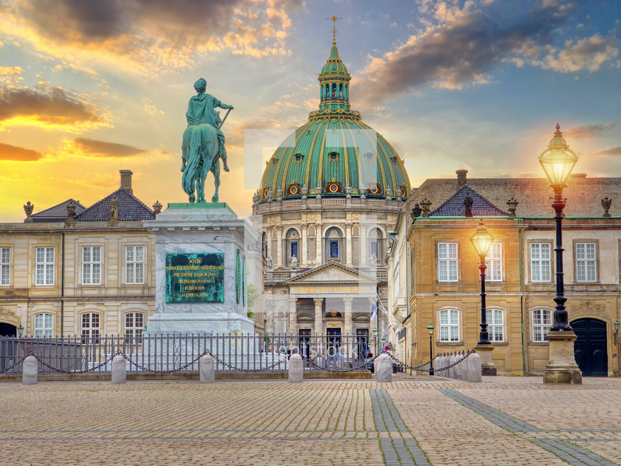 Frederik's Church known as The Marble Church and Amalienborg palace with the statue of King Frederick V. Amalienborg is the home of the Danish royal family. Copenhagen, Denmark.