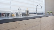 Tracking shot of a large luxury kitchen with wood finish modern design