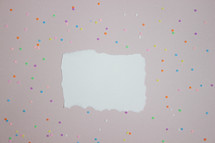Blank note on confetti background