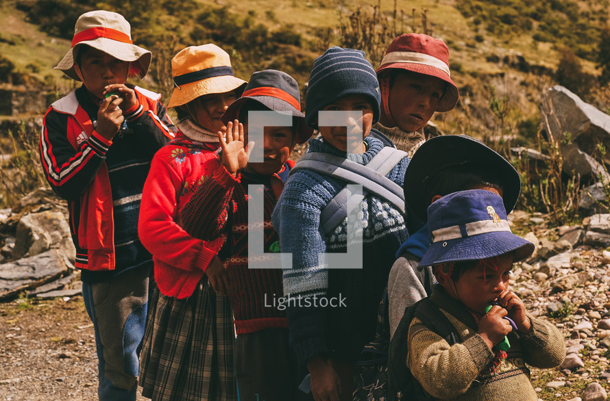 children waving in Peru 