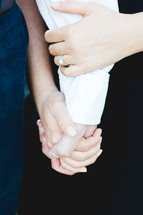 engaged couple holding hands 