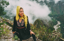 a woman with a camera hiking in Peru 