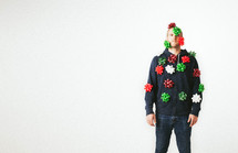 A man covered in Christmas bows