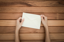 a man opening an envelope 