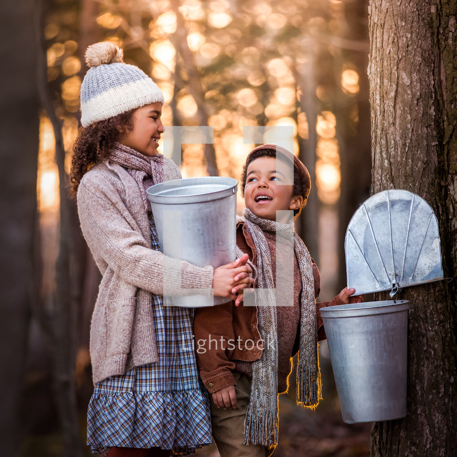 children collecting maple syrup 