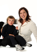Woman sitting on the floor with a young boy in her lap
