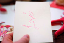 word love on a Valentines card