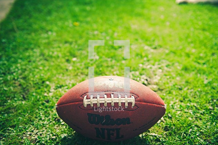 a football in the grass 