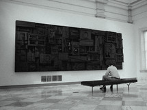 man enjoying art in a museum 