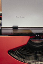 Letter to God on a typewriter.
The start of a prayer...