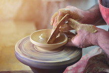 Creating a jar or vase of white clay close-up