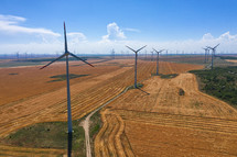 Eolian field and wind turbines farm on countryside in a sunny day