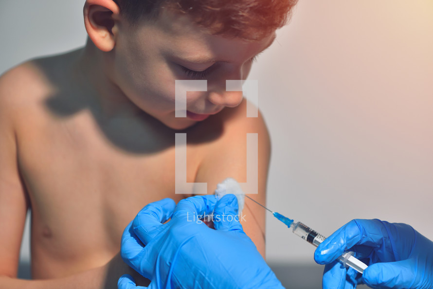 child receiving a vaccination 
