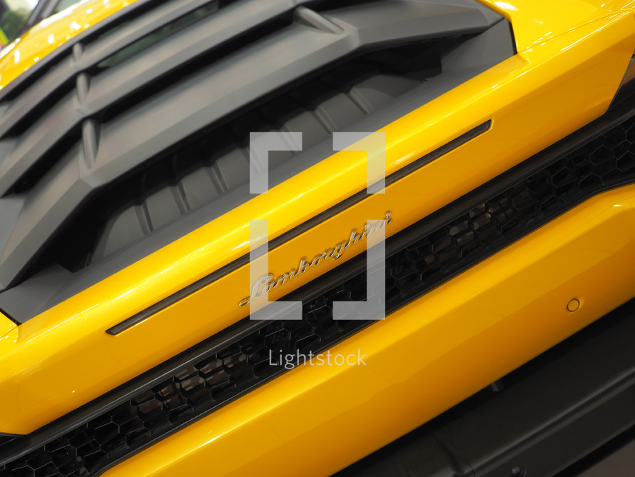 yellow Lamborghini Aventador S in showroom