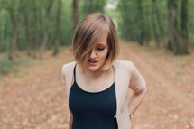 woman with a bob haircut standing outdoors 