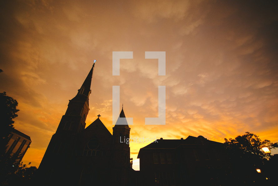 A church silhouetted at sunset