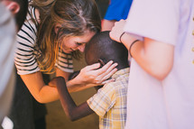 missionary woman greeting a child in Kenya 