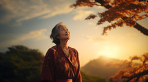 Older Asian woman looking up at the sky. 