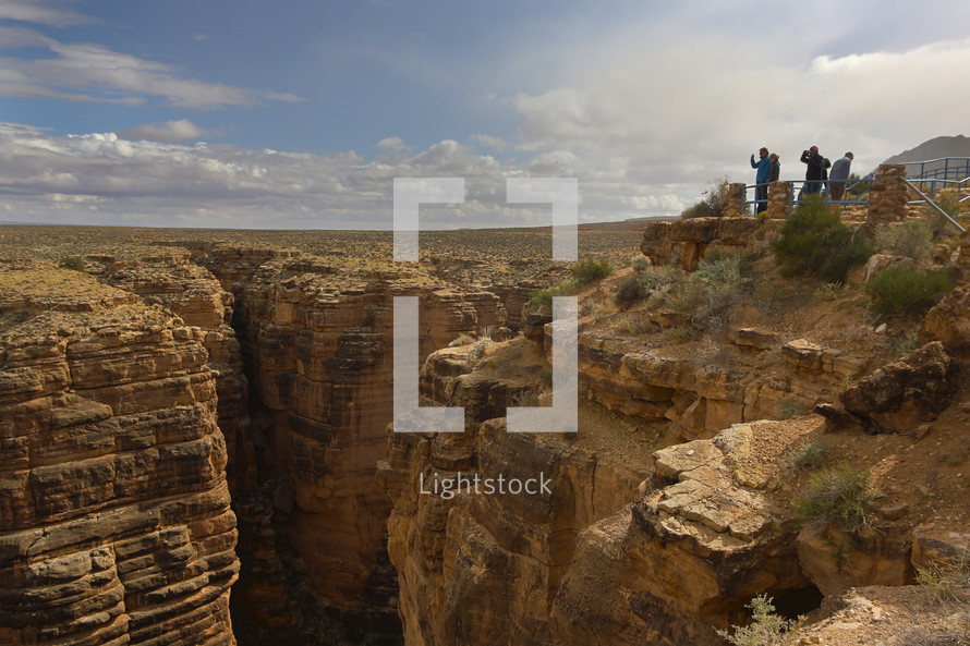 tourists at a canyon lookout