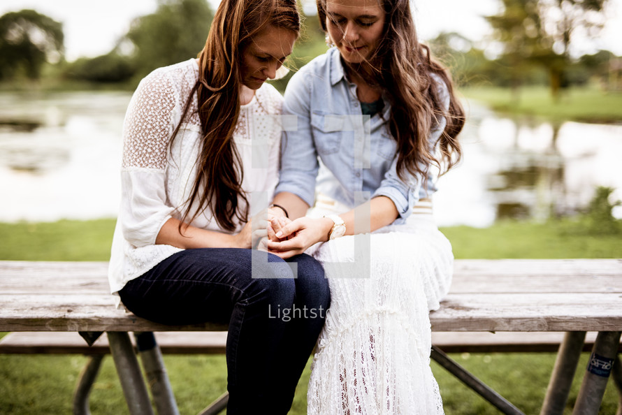 mother and daughter praying together 