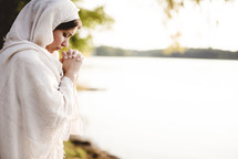 a woman in biblical time praying 