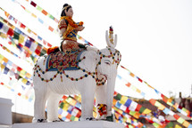 statue of a woman on an elephant in Tibet