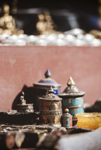 brass jars at a temple in Tibet