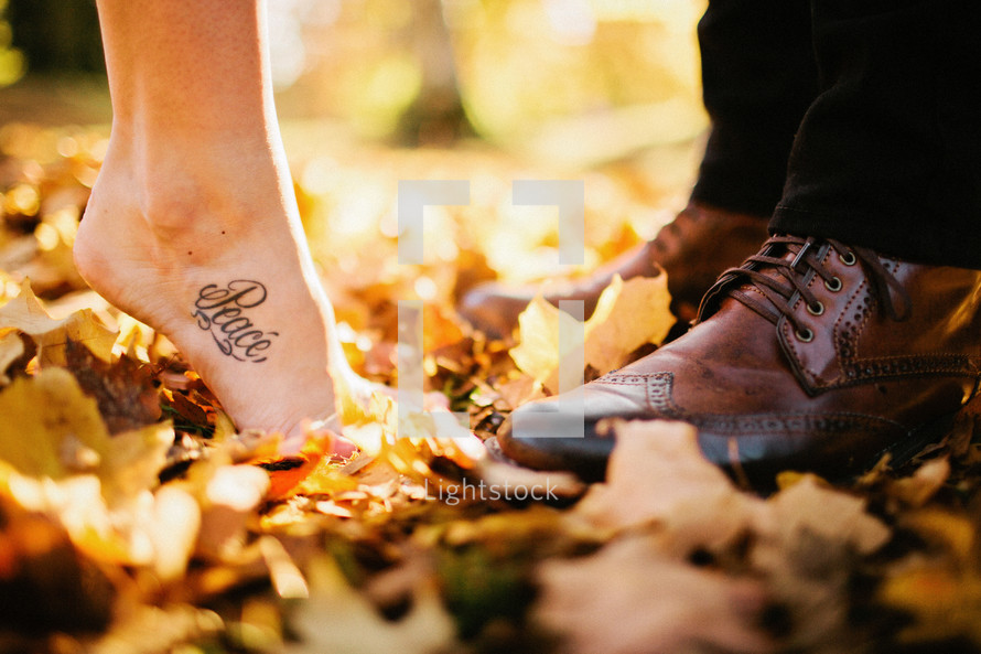 Couple standing in leaves