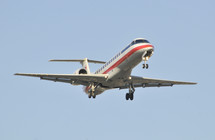 Commercial airplane with its landing gear down. Jet passenger aircraft. American Airlines.